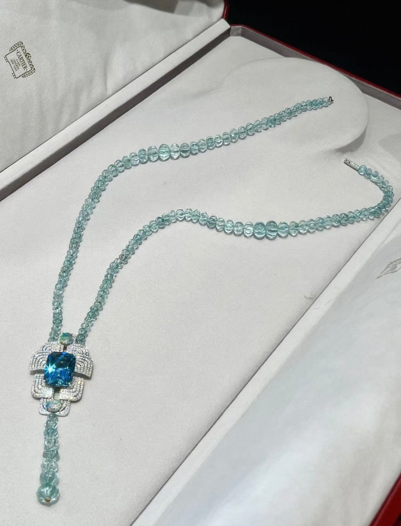 Cartier High Jewelry Necklace - Main stone: 37-carat aquamarine; two opals; chain beads: topaz.