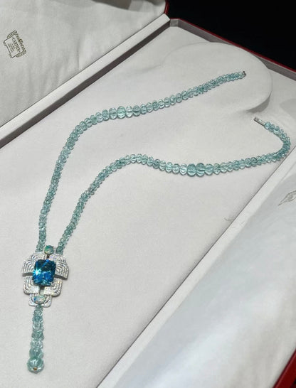 Cartier High Jewelry Necklace - Main stone: 37-carat aquamarine; two opals; chain beads: topaz.