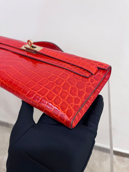 Hermes Kelly cut red shiny crocodile leather gold hardware