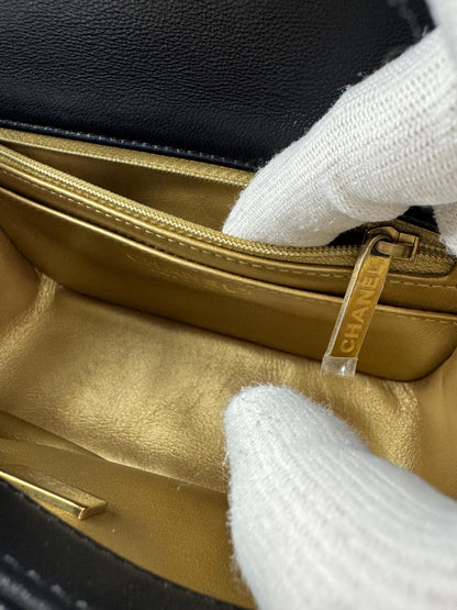 Chanel black mini flap bag with gold hardware