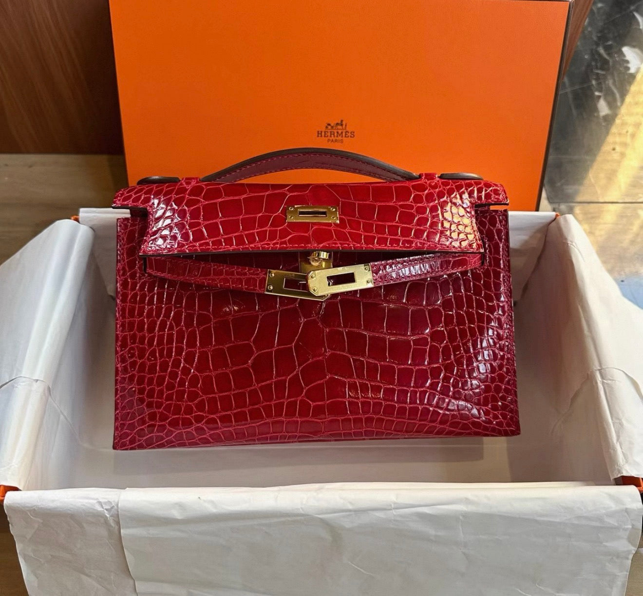 Hermes Kelly Pochette Red shiny crocodile leather gold hardware