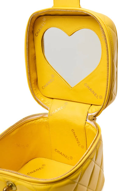 CHANEL 1995 VINTAGE "BARBIE" YELLOW PATENT HEART-MIRROR VANITY CASE BAG