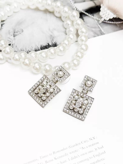 Chanel Spring/Summer 2024 silver double C pearl stud earrings