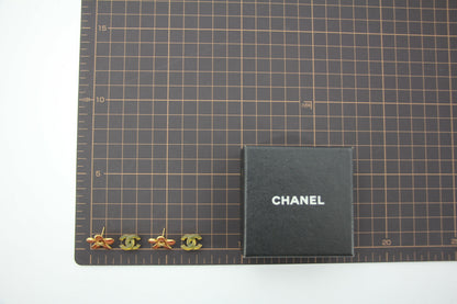Chanel 03P Enamel Orange Five-Petal Flower Green CC Stacked Earrings