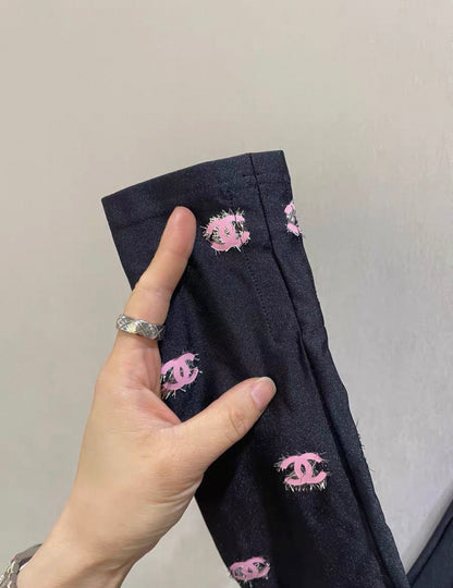 Chanel 21K ski top with pink cc logos