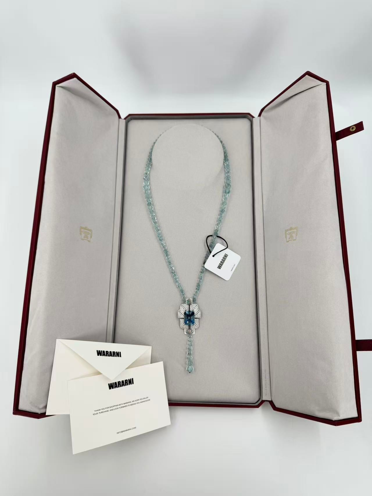 Cartier High Jewelry Necklace - Main stone: 37-carat aquamarine; two opals; chain beads: topaz.