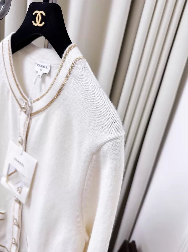 Chanel 26c white knit cardigan with gold trim and two pockets