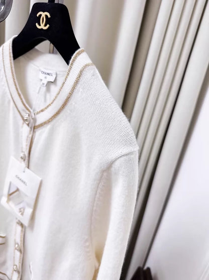 Chanel 26c white knit cardigan with gold trim and two pockets