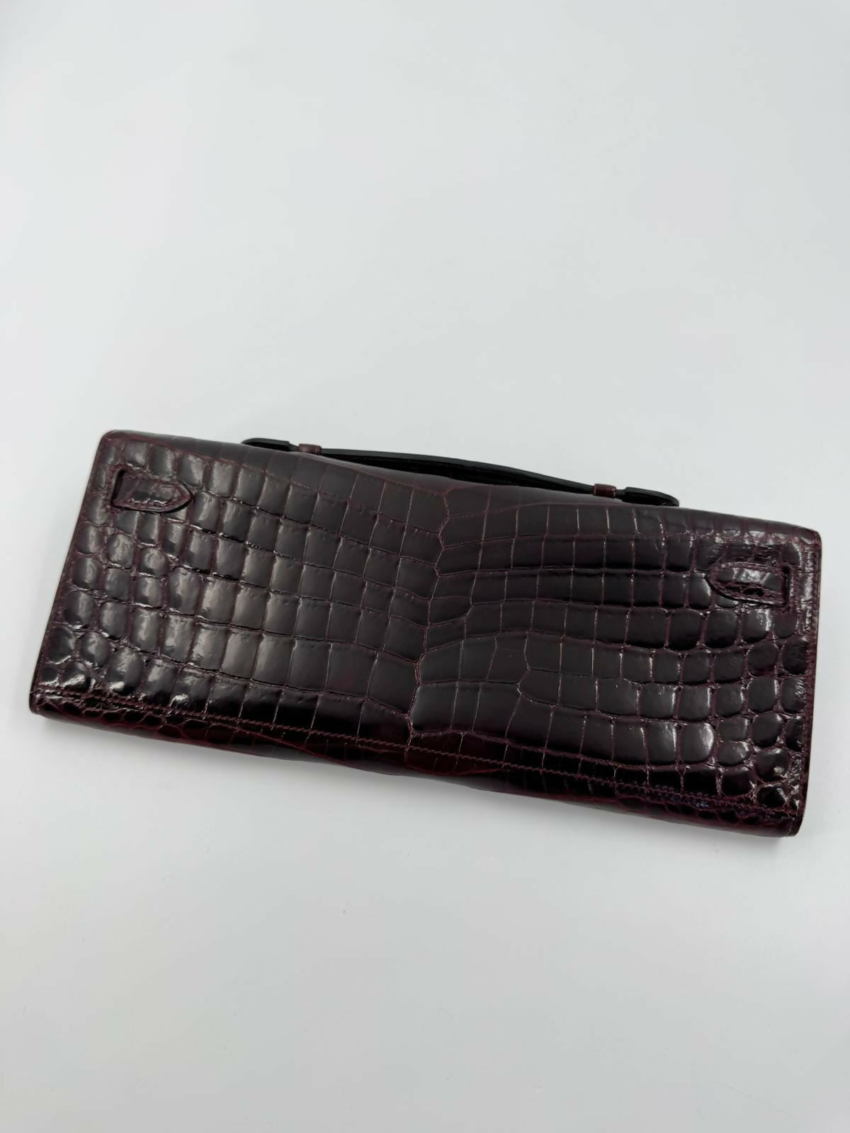 Hermès Kelly Cut Bag in Bordeaux Shiny Porosus Crocodile Leather with PHW
