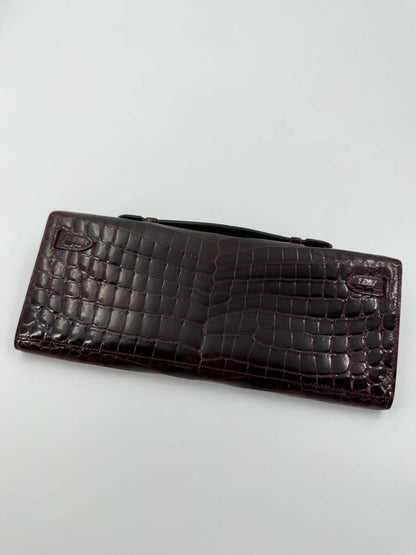 Hermès Kelly Cut Bag in Bordeaux Shiny Porosus Crocodile Leather with PHW