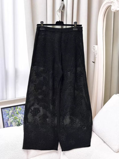 Chanel 23S black knit wide-leg pants with rhinestone buttons