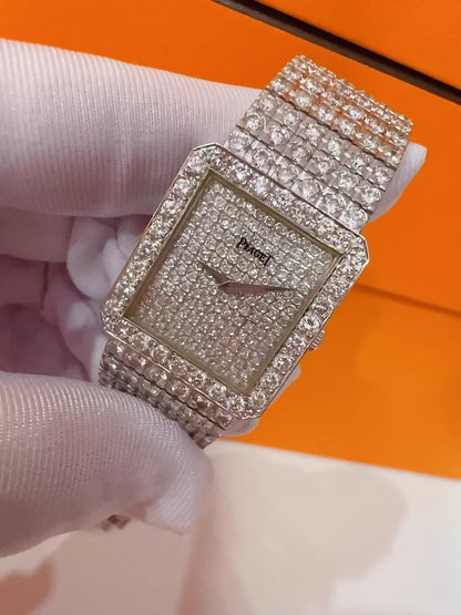 Vintage Piaget men's watch with diamond-set bezel and bracelet, quartz movement