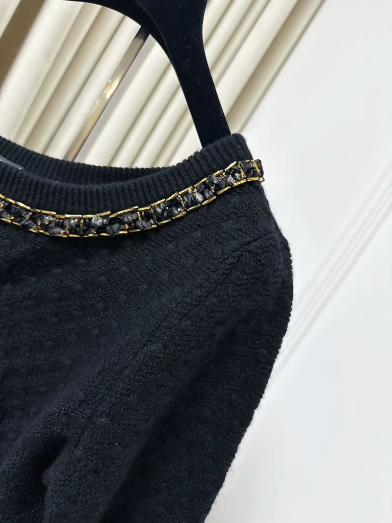 Chanel 23B black cashmere sweater, adorned with chains, pearls and sequins