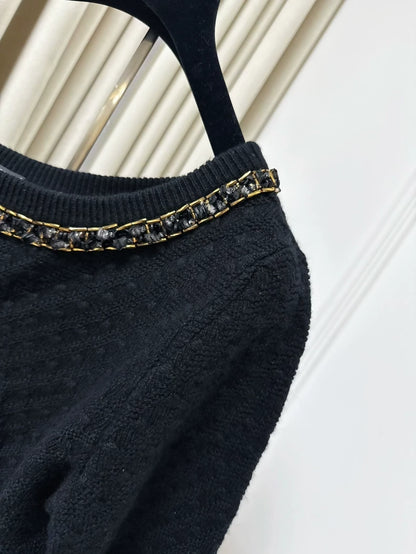 Chanel 23B black cashmere sweater, adorned with chains, pearls and sequins