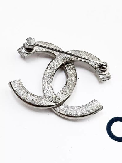 Chanel 23P silver brooch with full diamond embossing