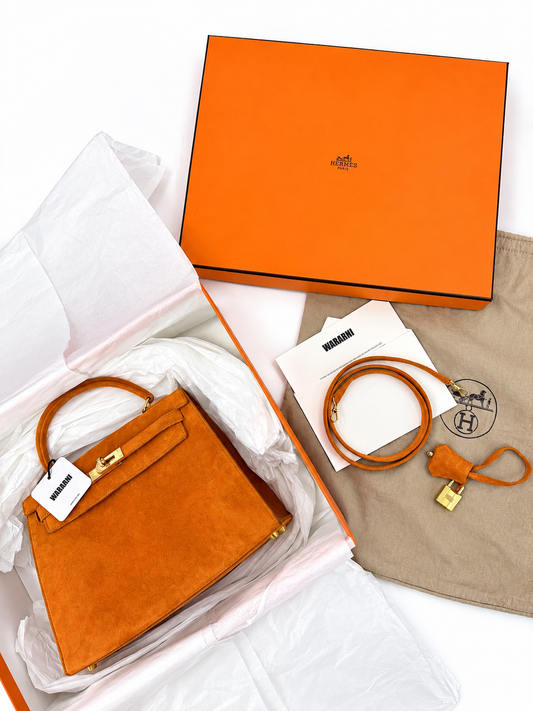 Hermès Kelly 25 Orange Veau Doblis Sellier 18K gold & diamond hardware
