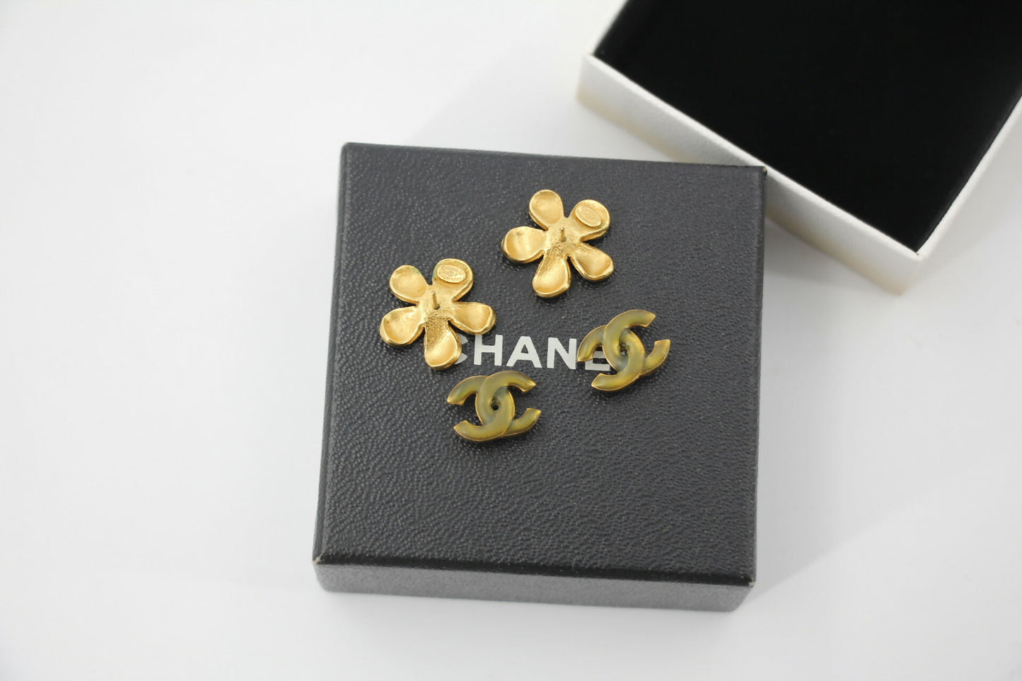 Chanel 03P Enamel Orange Five-Petal Flower Green CC Stacked Earrings