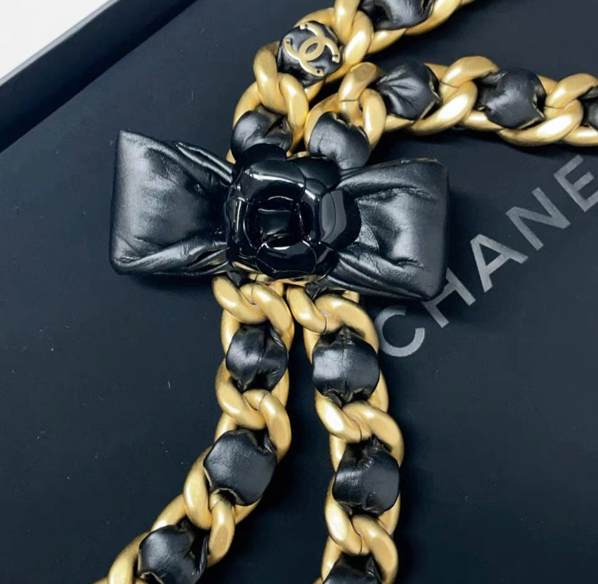 Chanel 20A tie style gold & black ribbon bow with camellia flower leather chain necklace