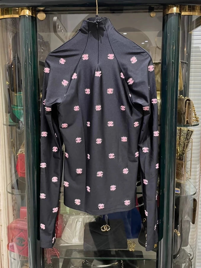 Chanel 21K ski top with pink cc logos
