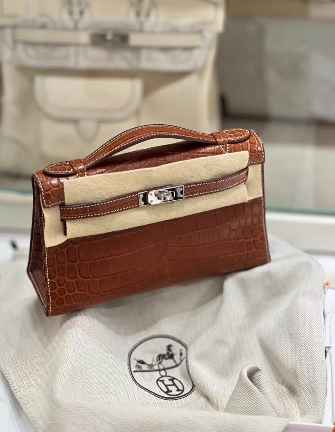 HERMÈS KELLY POCHETTE FAUVE BARÉNIA NILOTICUS CROCODILE PALLADIUM HARDWARE