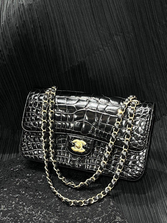 Chanel black shiny crocodile leather medium flap gold hardware