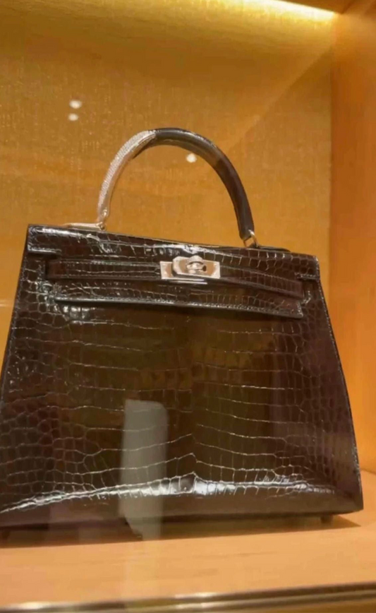 HERMES KELLY 25 MIDAS SHINY BLACK POROSUS CROCODILE SELLIER WITH 18K WHITE GOLD HARDWARE & DIAMOND HANDLE