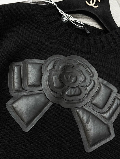 Chanel 20k black leather camellia bow knit top