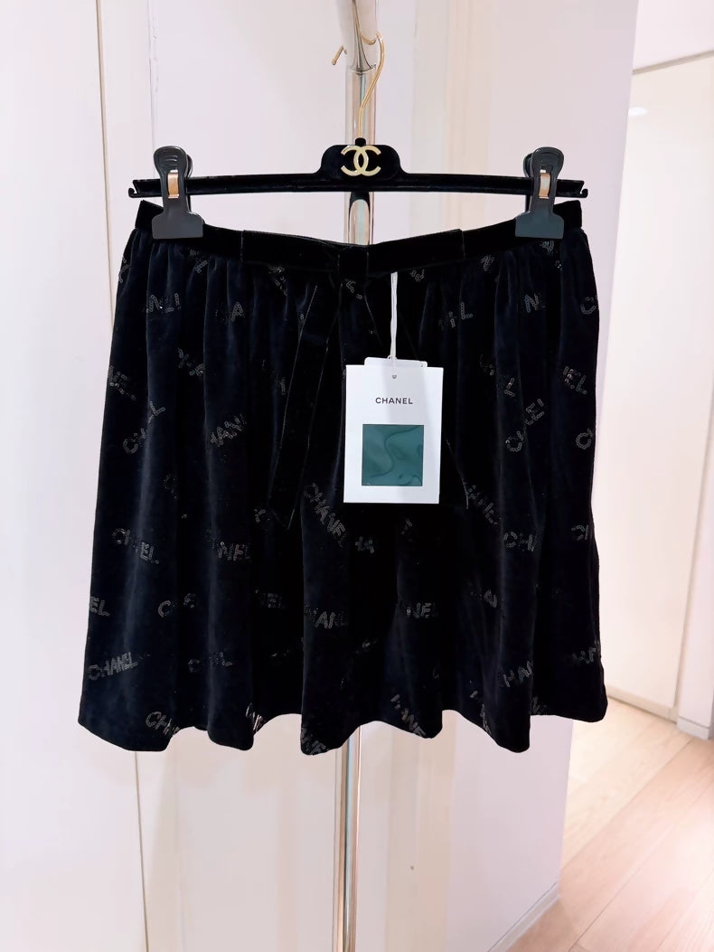 Chanel 22B Black Sequined Logo Bow Skirt