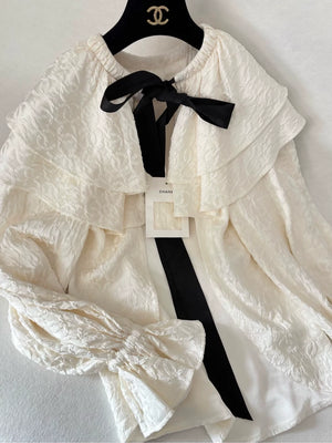 Chanel 25K ecru silk all-over logo bow cape cardigan