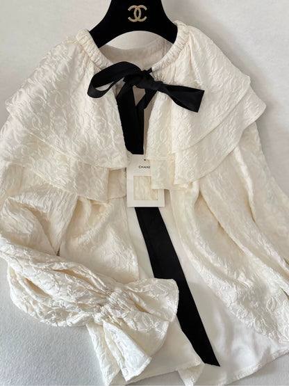 Chanel 25K ecru silk all-over logo bow cape cardigan