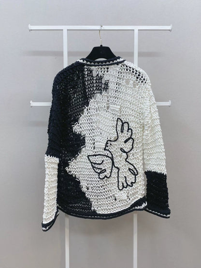 CHANEL 22C "Dove of Peace" white and black cardigan