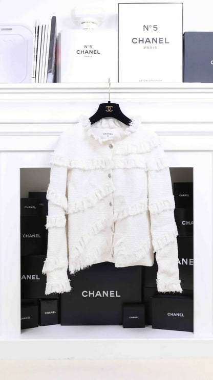 Chanel 2014 off white tweed jacket.