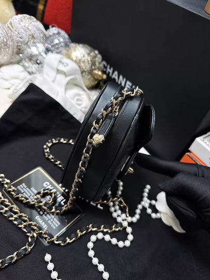 Chanel 22S black and gold quilted heart-shaped crossbody bag