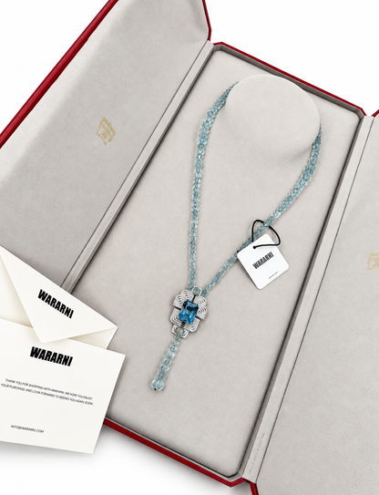 Cartier High Jewelry Necklace - Main stone: 37-carat aquamarine; two opals; chain beads: topaz.