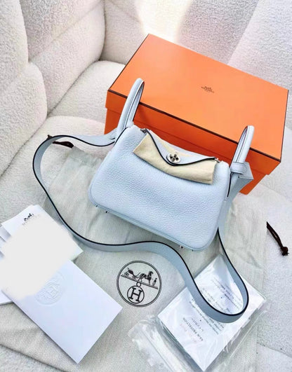 HERMÈS Mini Lindy shoulder bag in Bleu Pale Taurillon Clemence leather with Palladium hardware