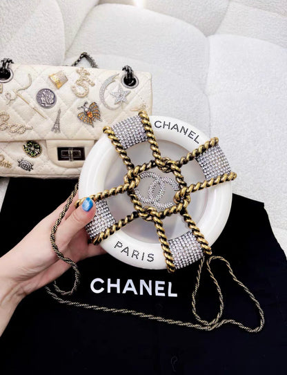 CHANEL MINAUDIÈRE LIMITED EDITION WHITE, GOLD & CLEAR RESCUE WHEEL GOLD-TONE HARDWARE