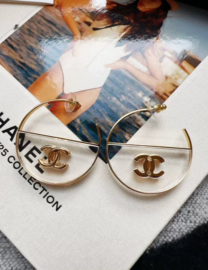 Chanel 23S gold double C transparent acrylic hoop earrings