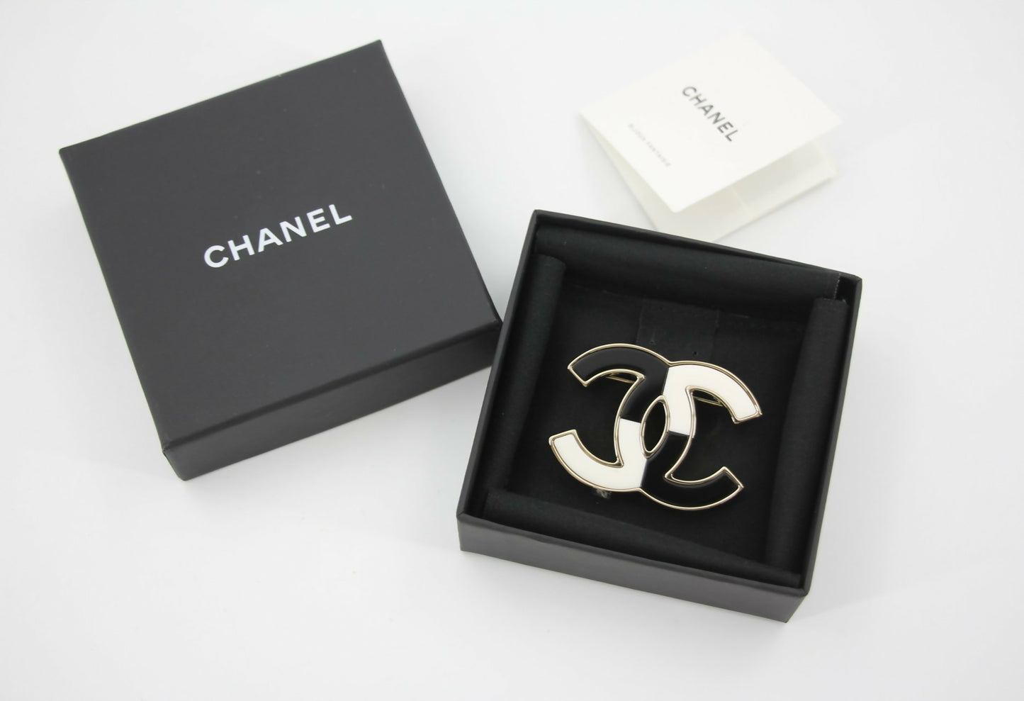 Chanel B23C Enamel Black and White Two-Tone CC Brooch