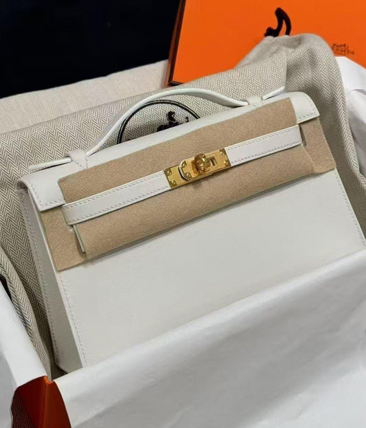 Hermès Kelly pochette White Swift Gold hardware