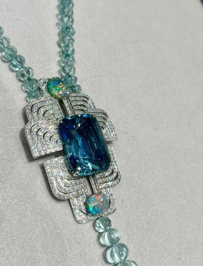 Cartier High Jewelry Necklace - Main stone: 37-carat aquamarine; two opals; chain beads: topaz.