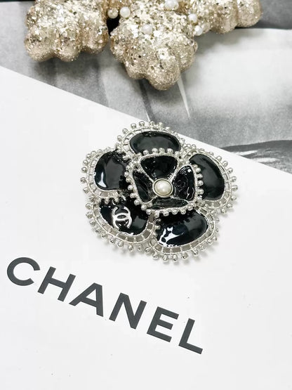 Chanel Fall/Winter 2023 black and silver pearl double C logo camellia brooch