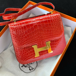Hermès Constance 19 Rouge Agate Shiny Porosus Crocodile (^) with Gold Hardware