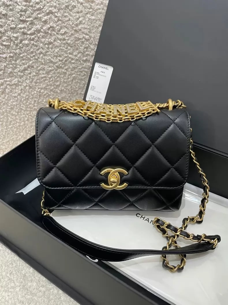 Chanel black and gold lettering rhinestone shoulder bag