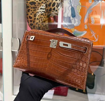 HERMÈS KELLY POCHETTE FAUVE BARÉNIA NILOTICUS CROCODILE PALLADIUM HARDWARE