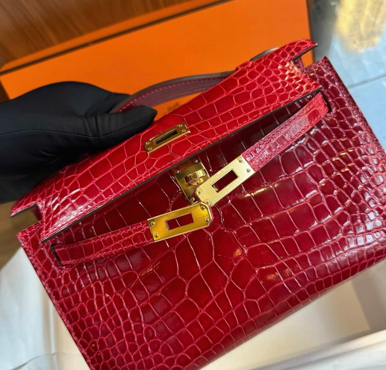 Hermes Kelly Pochette Red shiny crocodile leather gold hardware