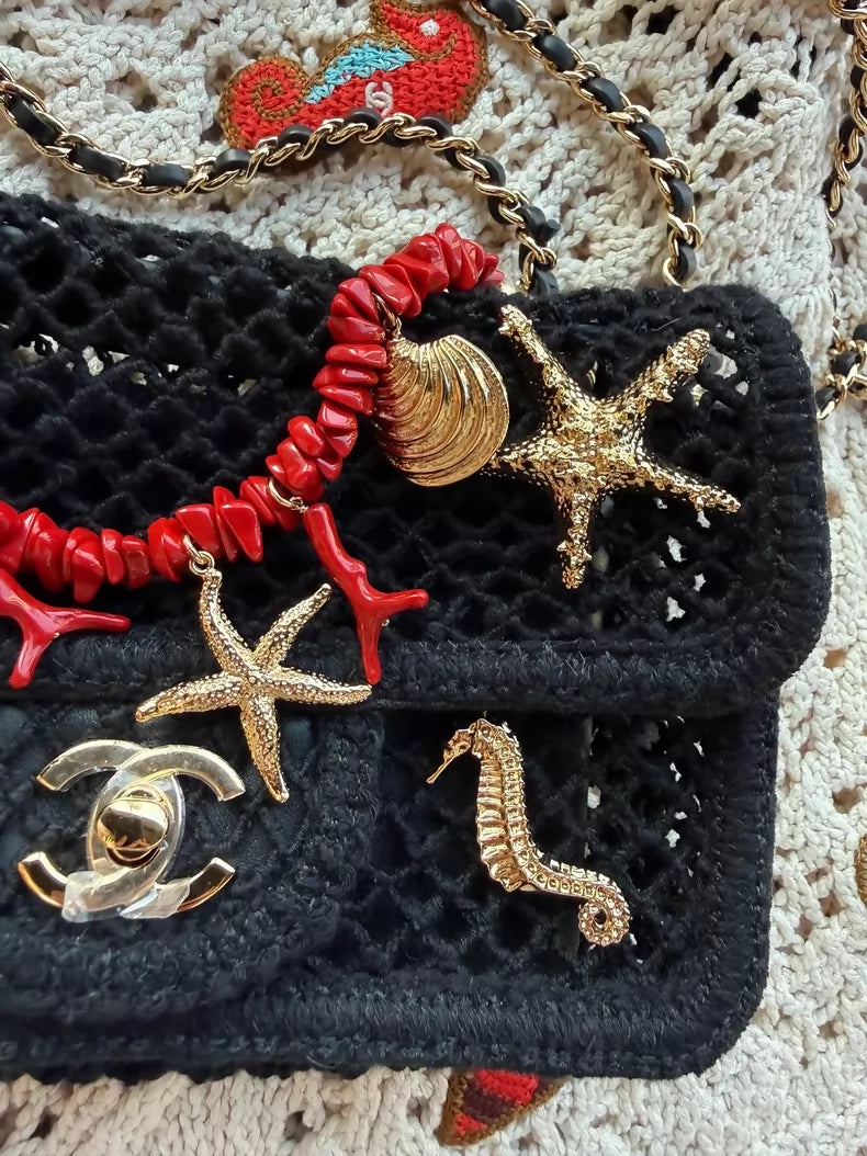 Chanel 26M black knit bag with gold ocean charms and red corals