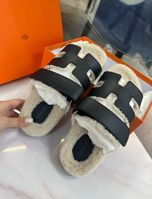 Hermès Black Leather Shearling Chypre Sandals