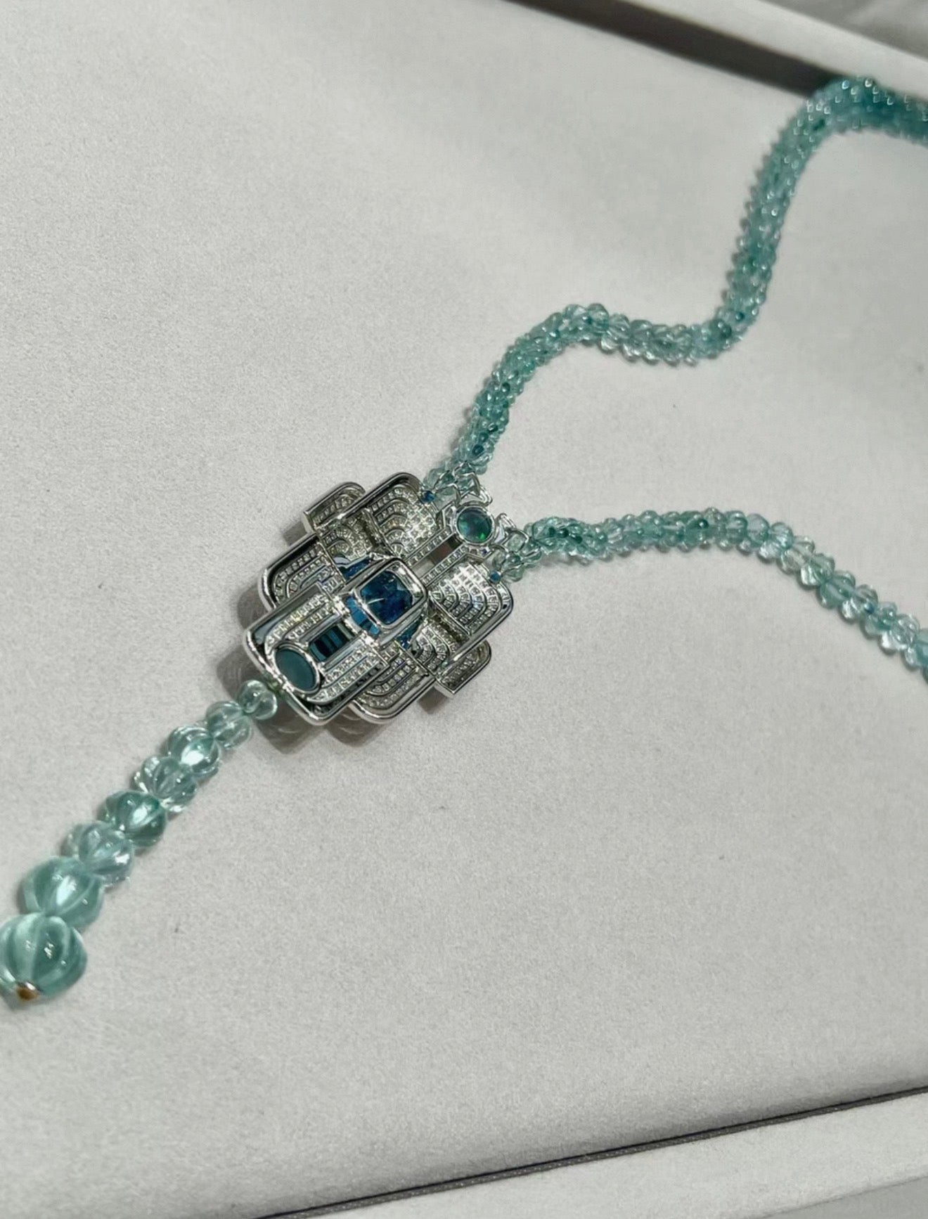 Cartier High Jewelry Necklace - Main stone: 37-carat aquamarine; two opals; chain beads: topaz.