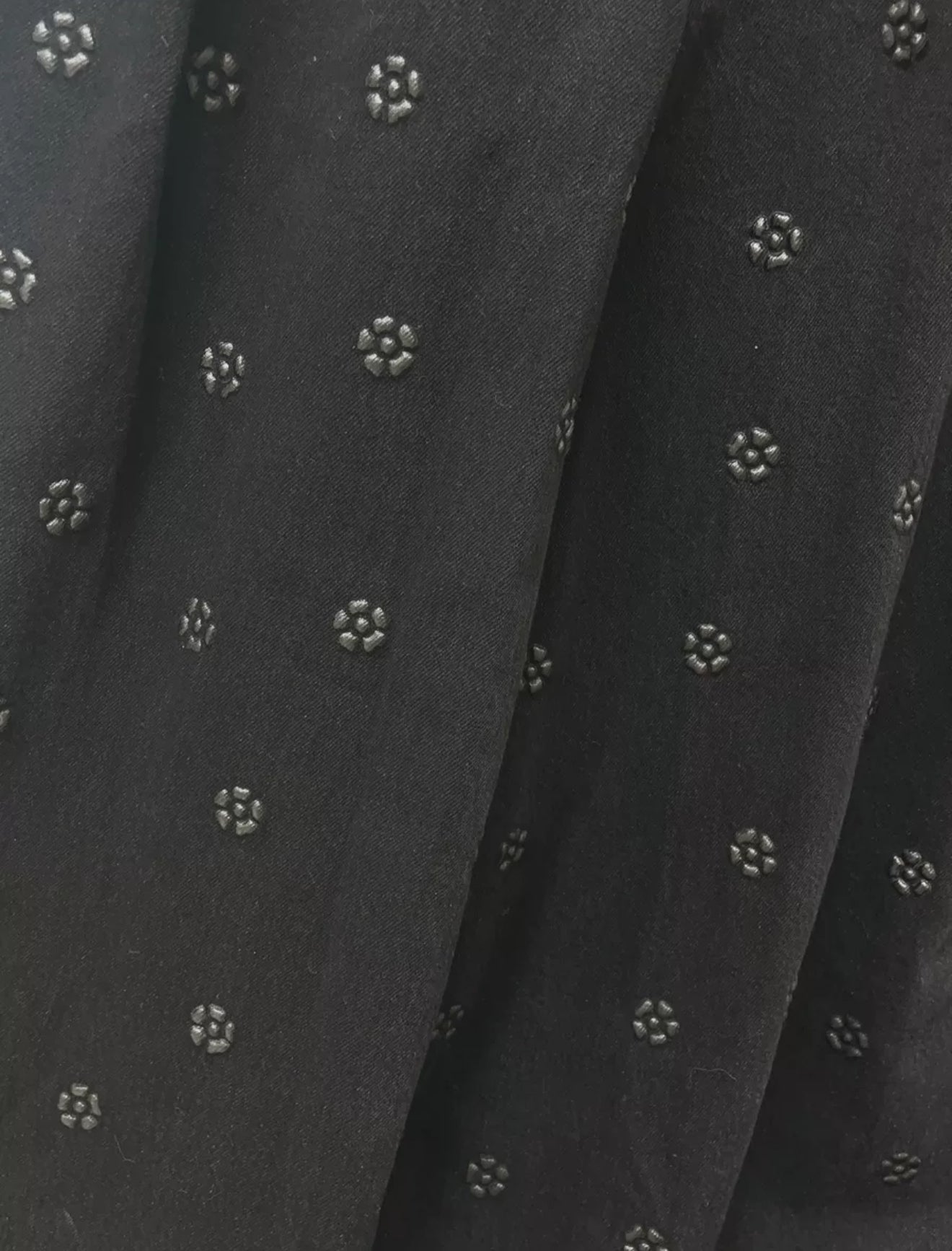 Chanel 23K black camellia wide-leg denim pants