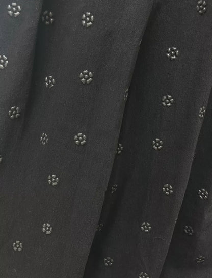 Chanel 23K black camellia wide-leg denim pants